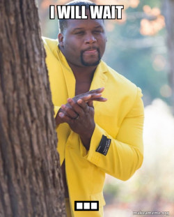 Anthony Adams in Yellow Suit Rubbing Hands