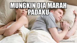 Couple thinking in bed