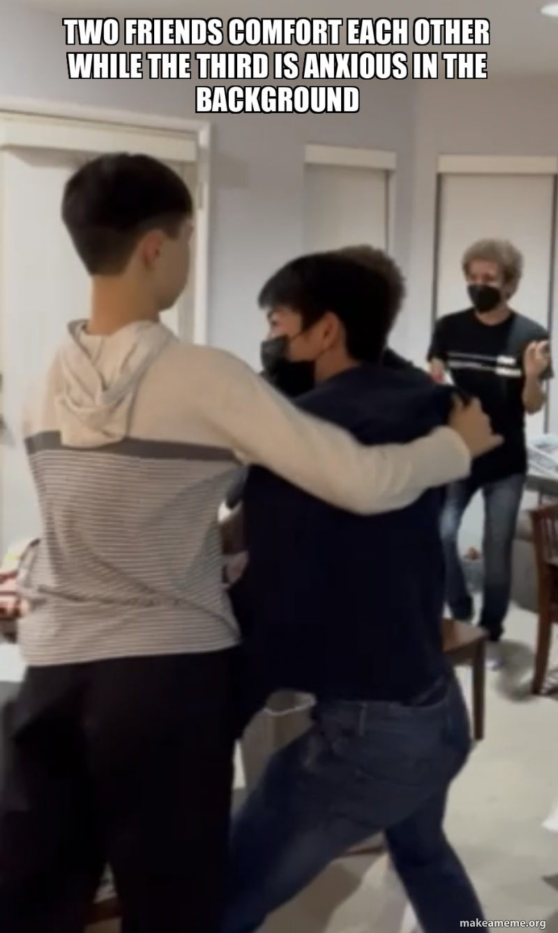 TWO FRIENDS COMFORT EACH OTHER WHILE THE THIRD IS ANXIOUS IN THE ...